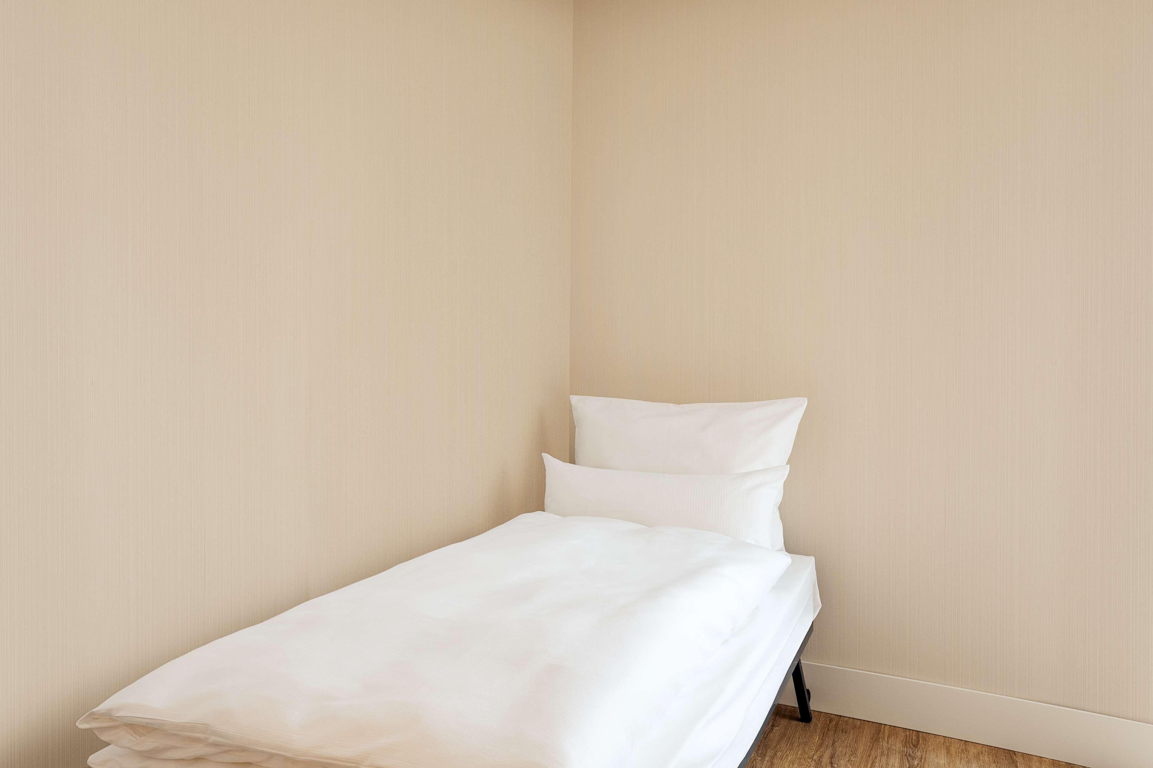 Nh City Sued Hotel